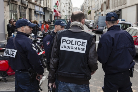  Criminal police investigates scene outside the Carillon bar in Paris, France.