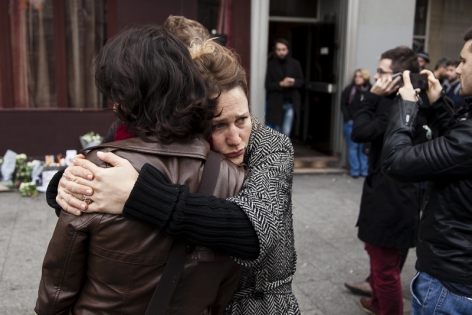  French mourn the victims outside the Carillon bar in Paris.