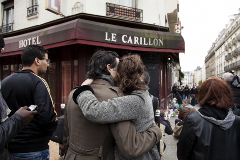  French mourn the victims outside the Carillon bar in Paris.